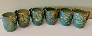 lot 370 image: Six Roseville Bushberry Pottery Mugs