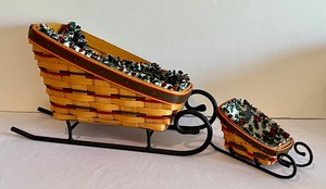lot 391 image: Two Longaberger Metal Sleigh Basket Holders with Baskets