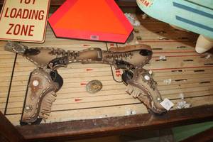 lot 549 image: Vintage Toy Revolver Set with Holster and Belt Buckle