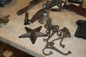 lot 644 image: Lot of (9) Cast Iron Home Dcor - Bells, Star, Coat Hooks, Anvil