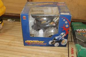 lot 672 image: Monster Tumbler RC Car (in original packaging)