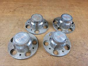 lot 2259 image: Set of (4) GMC 5-Bolt Diecast Center Caps
