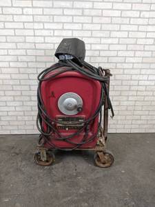 lot 2172 image: LINCOLN IdealARC Arc Welder - Model AC-250 - 230V 1PH - Includes Rolling Cart, Cables and Helmet - NO SHIPPING