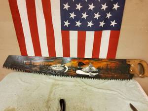 lot 28 image: Hand painted saw blade.