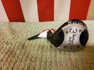 lot 11 image: Golf club driver hand carved woodpecker