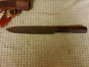 lot 9 image: Fixed blade knife , with decrotive Indian decoration and leather sheath.