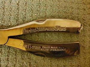 lot 14 image: Overland fishermans friend vintage fishing Leatherman  tool with leather sheath.