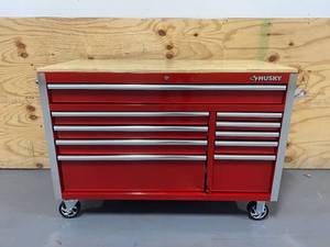 lot 30 image: HUSKY 52 in. W x 24.5 in. D Standard Duty 10-Drawer Mobile Workbench Tool Chest with Solid Wood Top in Gloss Red