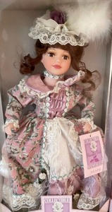 lot 103 image: New Collectable Memories Hand Crafted Porcelain Dolls