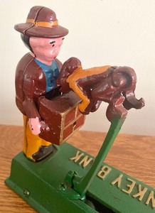 lot 143 image: Cast Iron Jumping Monkey Bank