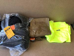 lot 55 image: Mix Lot of Dewalt Work Pants, Carhartt Jacket, Construction T shirt - Customer Returns- Review all pictures