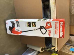 lot 84 image: Homelite 13 in. 4 Amp Straight Electric String Trimmer May Contain Missing Pcs Review all pictures
