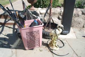 Clothes basket filled with sporting...