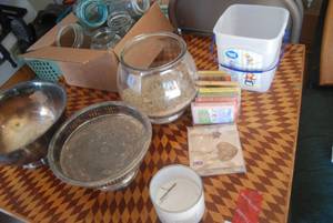 Mason jars, fish bowl with sand, ca...
