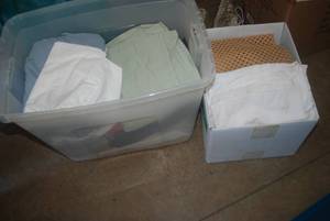 Tote and box full of sheets and pil...