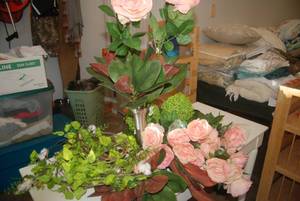 Artificial flowers and a metal vase...