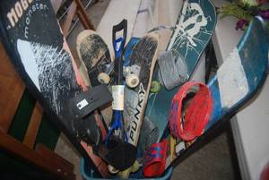 Tote full of skateboards, snow boar...