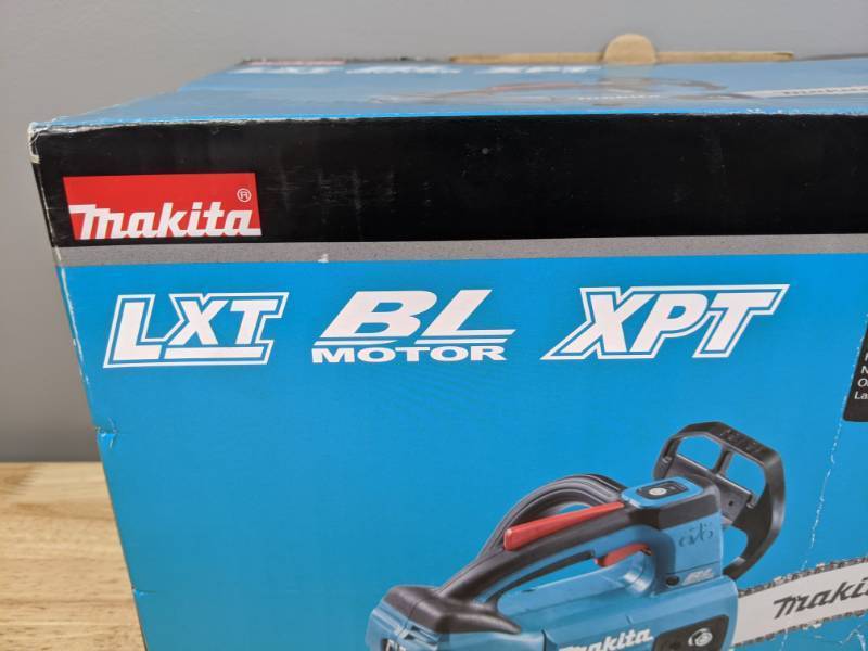 lot 28 image: Brand New Makita 10 in. 18-Volt LXT Lithium-Ion Brushless Cordless Top Handle Chain Saw XCU06Z T