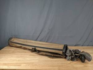 lot 105 image: Tan Golf Club Bag with Golf Clubs Driver, 5 Iron, 6 Iron and More N