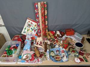 lot 210 image: Christmas Goodies  Wrapping Paper, Bows, Window Clings, Candle Holders, New Dish Towels, Ornaments, and More  Y