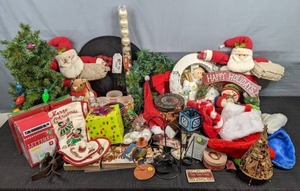 lot 297 image: Array of Christmas Decor Happy Holidays Wreath, Merry Christmas Wreath, Santa Decor, Stockings, & More Z