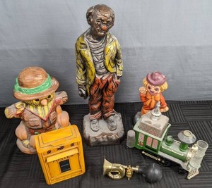 lot 272 image: Wonderful Vintage Collection Train Decanter Set, Clown Piggybank, Scarecrow Cookie Jar, Clown Statue, & More Y