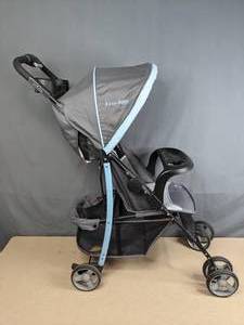 lot 235 image: Pink, Grey, and Blue Jeep Stroller  Z
