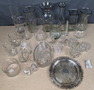 lot 243 image: Large Lot of Glass Vases, Silver Oneida Charger, Basset Hound Figure, Candle Holders, Chip and Dip Plates and More Z