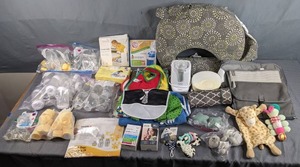 lot 258 image: Large Assortment of NewUsed BabyInfant Items Bibs, The First Years Bottle Warmer, Bottles, Changing Pads, Breast Pump Accessories and More   Z