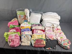 lot 259 image: Assortment of Baby Girl Items  Cloth Diapers, Cloth Diaper Covers, Cloth Maxi Pads, and More    Z