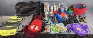 lot 260 image: Collection of Pet Supplies MN Vikings Pet Shirt, Carrier, Collars, Leashes, Harnesses, Booties, Dog Backpack, and More  Z