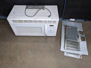 lot 383 image: General Electric Over-the-Range Spacemaker Microwave, White F