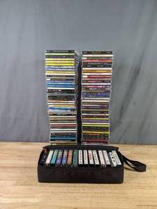 lot 87 image: Collection of CDs and Cassette Tapes in a Case Christmas Music, U2, Tom Petty, Celine Dion, and More  B