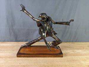 lot 387 image: Metal Art Figurine Guitar PlayerRockstar X