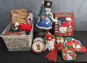 lot 402 image: Assortment of Christmas Decorations Velour Santa Suit, Potholders, Oven Mits, Clocks, Dish Towels, Snowman, Lights, Wrapping Paper, & More X