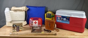 lot 457 image: Rubbermaid 34 Quart Cooler, Holiday Binoculars, Sunglasses, First Aid Kit, Mens Urinal, Sigma Fishing Reel and More   X
