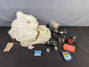 lot 469 image: An Assortment of Fishing Items Net, Hooks, Fishing Line, Reels, Etc.  X
