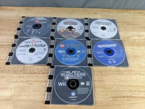 lot 550 image: Collection of (7) Wii Video Games - Disney Infinity, Tiger Woods PGA Tour 11, Rock Band, and more Z