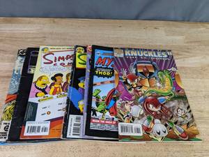 lot 555 image: Collection of 8 Comic Books Knuckles, The Simpsons, Blade, Cow and Chicken and More Z