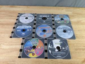 lot 530 image: Set of 8 Wii Games Just Dance 2, Disney Sing it Family Hits, Family Game Night 2, Call of Duty MW3 and More Z