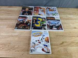 lot 543 image: Collection of (7) Wii Video Games - Deal or No Deal, LEGO Lord of the Rings, Toy Story 3, 90 Great Games Party Pack, and more Z