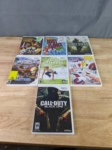 lot 545 image: Collection of (7) Wii Video Games - Star Wars The Clone Wars, Call of Duty Modern Warfare and Black Ops, Just Dance Kids, and more Z