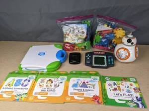 lot 592 image: Leap Frog Leap Start with Books, Handheld Hearts & Monopoly Games, Set of Funny Bricks, Star Wars BB-8 Bank  Z