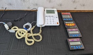lot 74 image: AT&T CL4940 Corded Telephone and Vintage Pocket Deuces, Radica and Keno Pocket Games