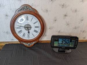 lot 76 image: Sharp Table Top Weather Station and Bulova Circle Wall Clock