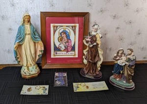 lot 79 image: Collection of Religious Dcor The Holy Family Figurine, St. Therese Figurine, Behold the King of Angels Art, Rosary, Cross Charms and More