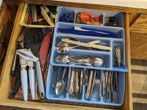 lot 44 image: Array of Kitchen Essentials Kitchen Aid Can Opener, Utensils, Knives, Measuring cups, & More