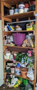 lot 117 image: Contents of 6-Tier Garage Shelf Planters, Faux Flowers, Watering Cans and More