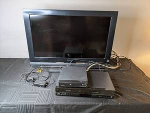 lot 148 image: Sony Bravia TV, Magnavox DVD Player, JVC VCR and DVD Combo