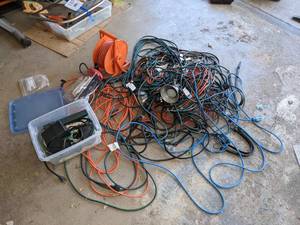 lot 199 image: Extension Cords Galore, Hanging Task Lights, Rubber Tarp Straps, Outdoor Timers and More